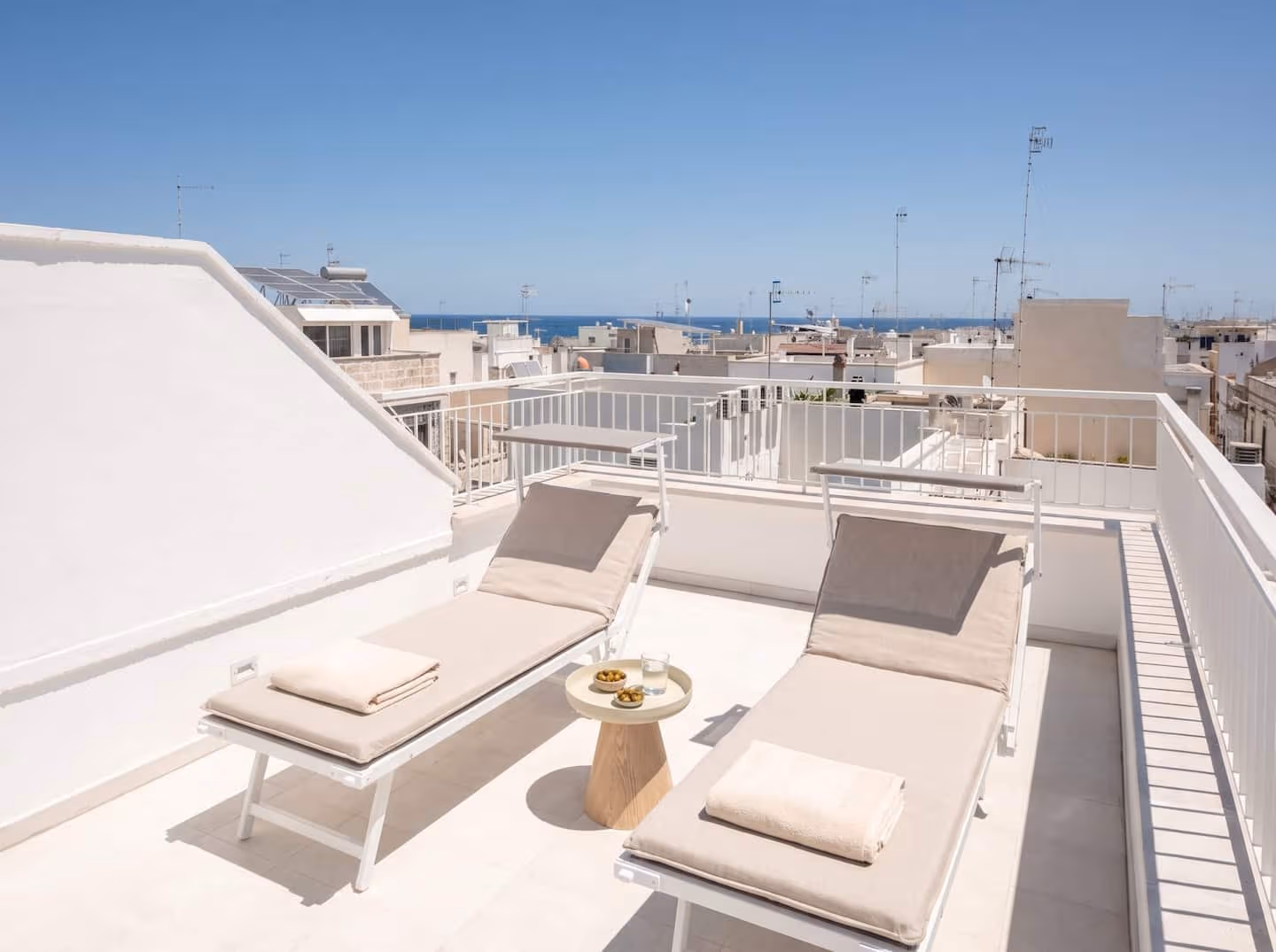 The rooftop solarium with loungers and sea views